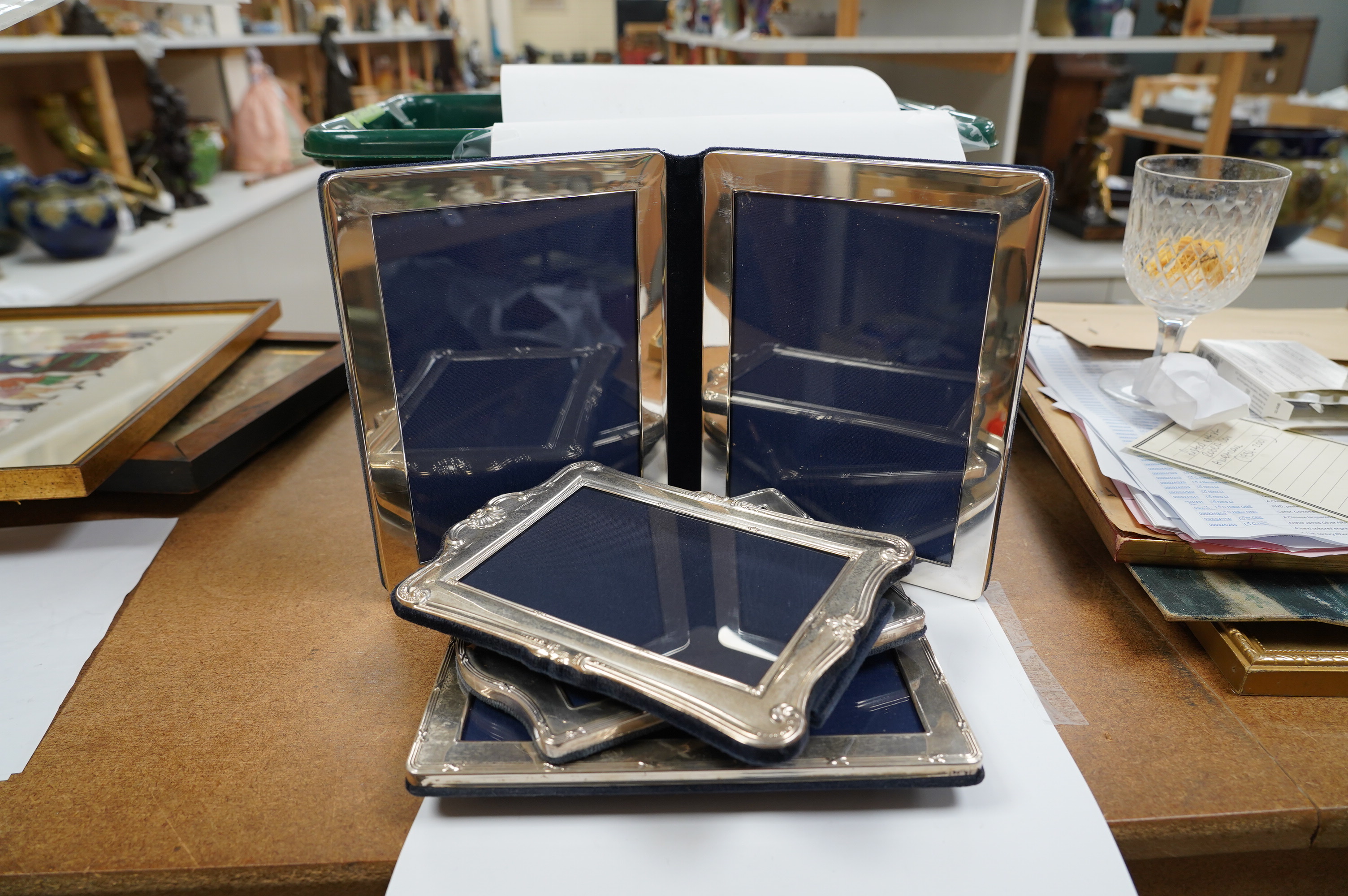 Four assorted silver mounted photograph frames including a double, largest 21.3cm. Condition - fair to good